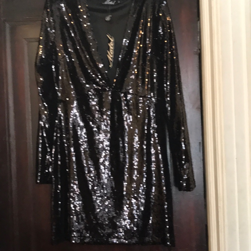 New with tags, black sequined dress.